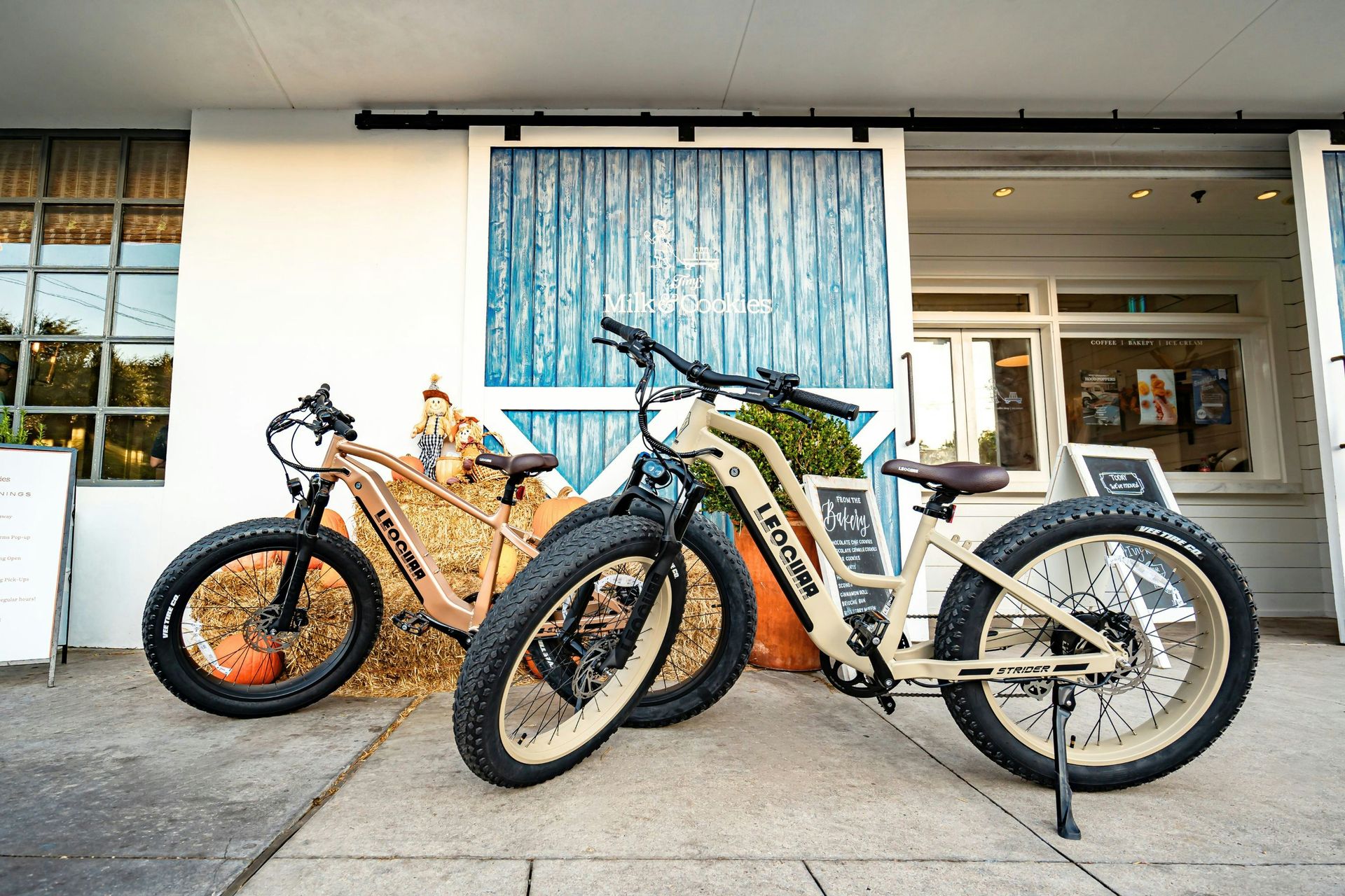 A couple of bikes parked in front of a building
